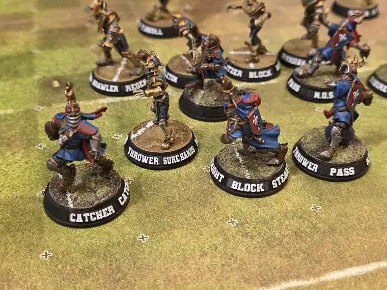 A painted team on based miniatures during a match