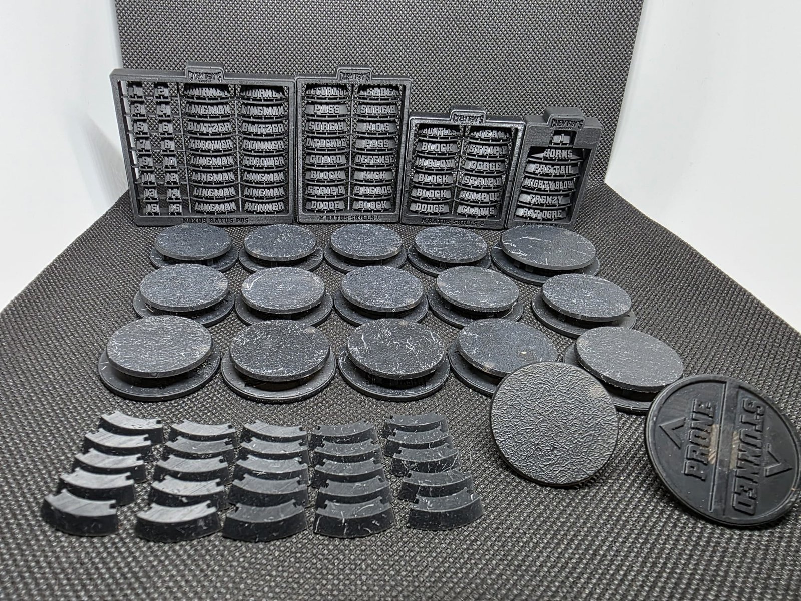 A complete Blitz Base set with sprue, magnet, and shell components laid out
